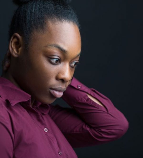 woman seriously thinking about the death of a loved one
